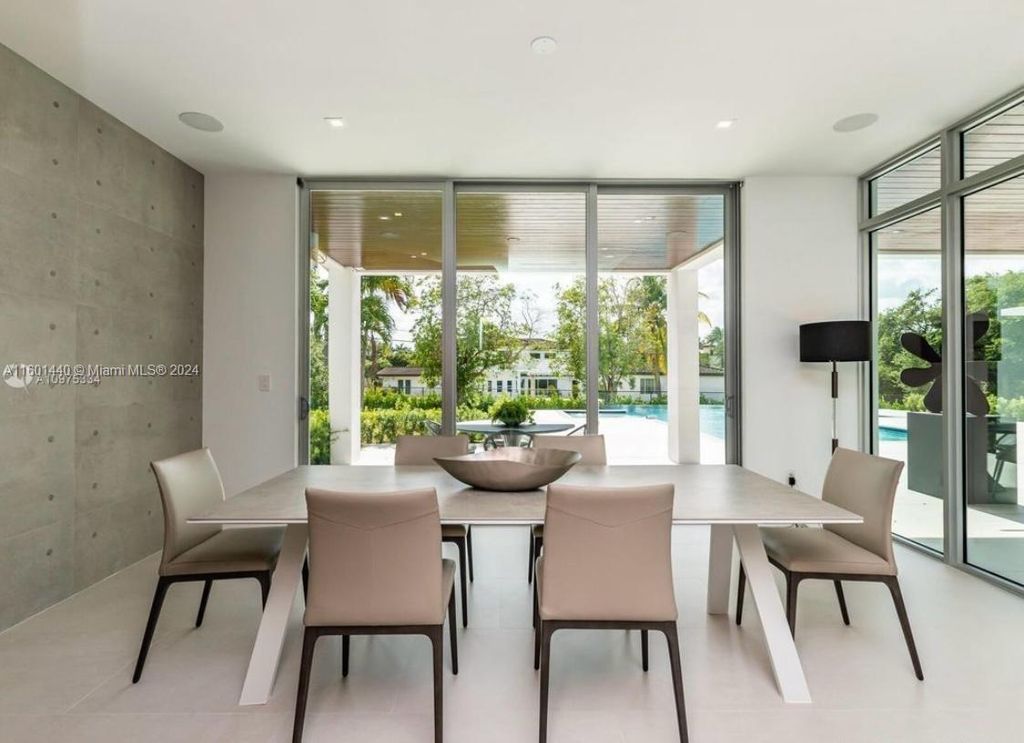 Featuring an infinity pool, a modern kitchen with top-of-the-line appliances, a stunning master suite, and close proximity to Gulliver Preparatory School, this expansive property offers the perfect blend of indoor and outdoor living.