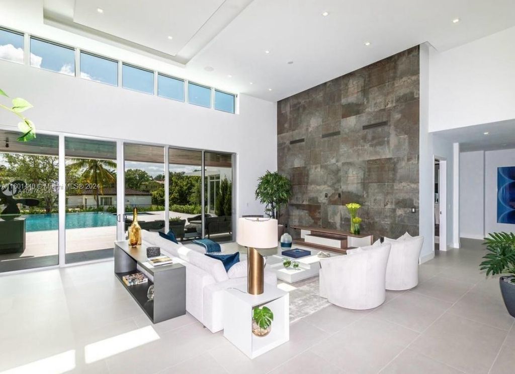 Featuring an infinity pool, a modern kitchen with top-of-the-line appliances, a stunning master suite, and close proximity to Gulliver Preparatory School, this expansive property offers the perfect blend of indoor and outdoor living.