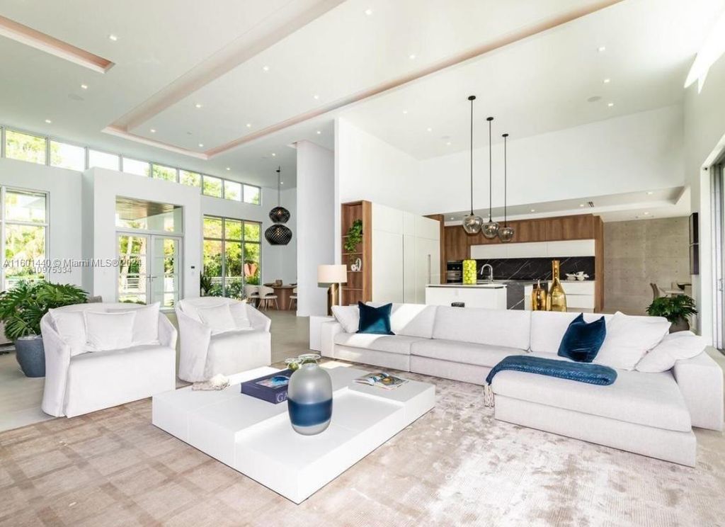 Featuring an infinity pool, a modern kitchen with top-of-the-line appliances, a stunning master suite, and close proximity to Gulliver Preparatory School, this expansive property offers the perfect blend of indoor and outdoor living.