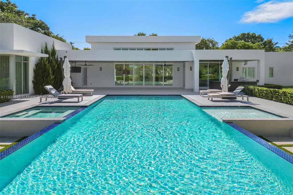 Featuring an infinity pool, a modern kitchen with top-of-the-line appliances, a stunning master suite, and close proximity to Gulliver Preparatory School, this expansive property offers the perfect blend of indoor and outdoor living.