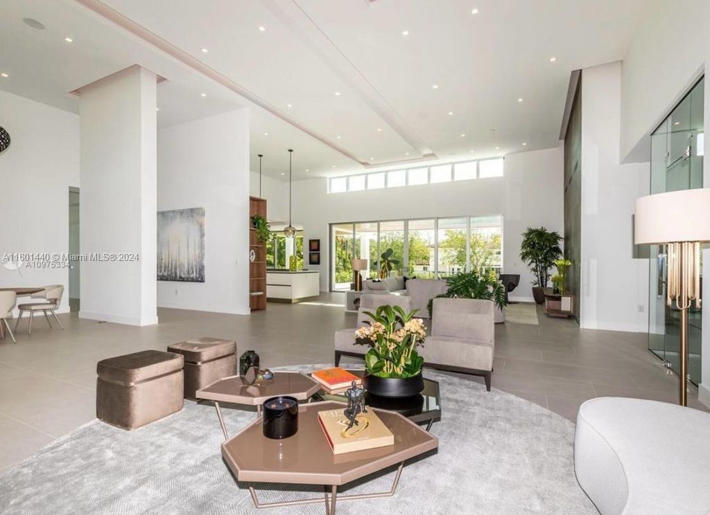 Featuring an infinity pool, a modern kitchen with top-of-the-line appliances, a stunning master suite, and close proximity to Gulliver Preparatory School, this expansive property offers the perfect blend of indoor and outdoor living.