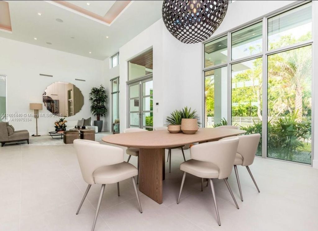 Featuring an infinity pool, a modern kitchen with top-of-the-line appliances, a stunning master suite, and close proximity to Gulliver Preparatory School, this expansive property offers the perfect blend of indoor and outdoor living.