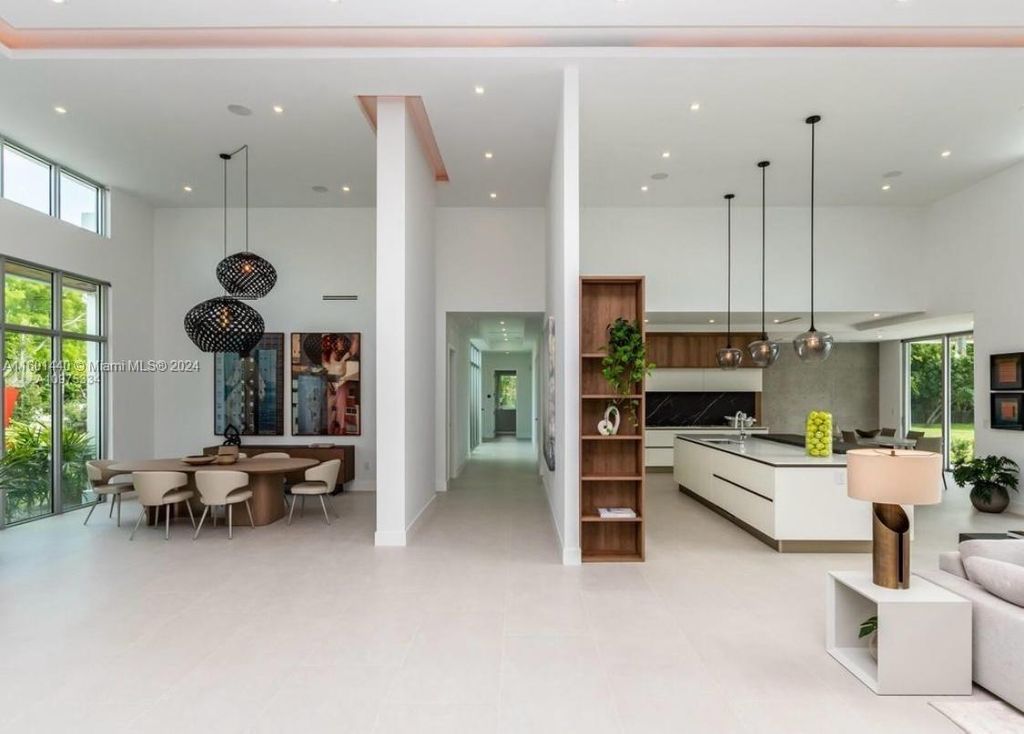 Featuring an infinity pool, a modern kitchen with top-of-the-line appliances, a stunning master suite, and close proximity to Gulliver Preparatory School, this expansive property offers the perfect blend of indoor and outdoor living.