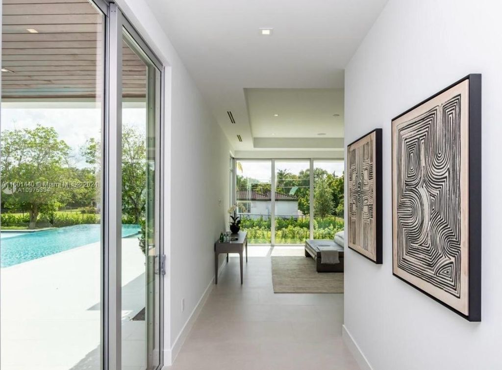 Featuring an infinity pool, a modern kitchen with top-of-the-line appliances, a stunning master suite, and close proximity to Gulliver Preparatory School, this expansive property offers the perfect blend of indoor and outdoor living.