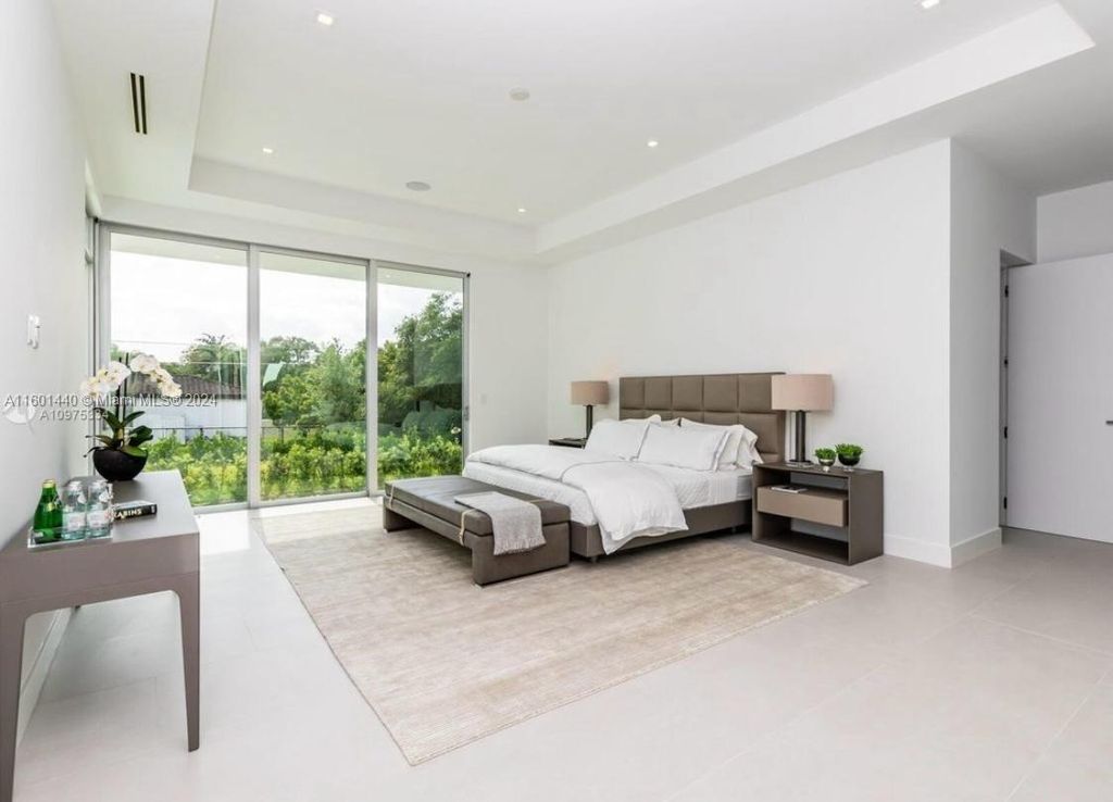 Featuring an infinity pool, a modern kitchen with top-of-the-line appliances, a stunning master suite, and close proximity to Gulliver Preparatory School, this expansive property offers the perfect blend of indoor and outdoor living.