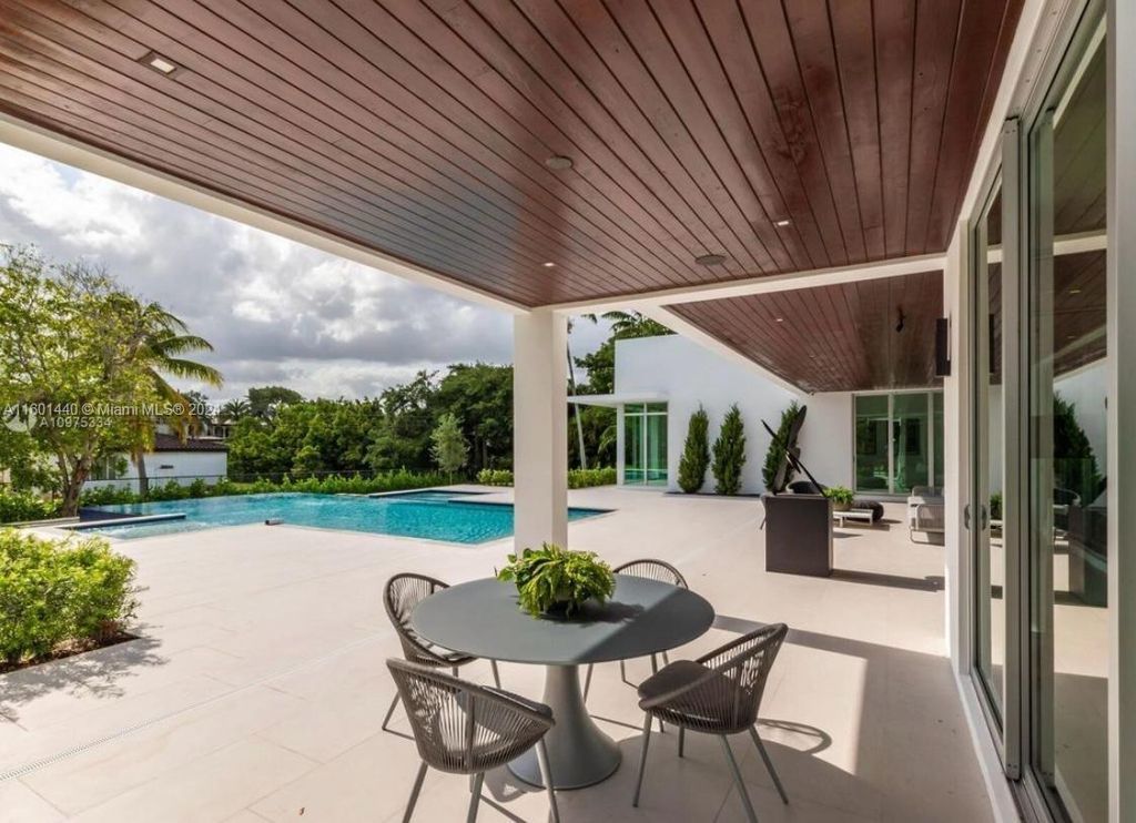 Featuring an infinity pool, a modern kitchen with top-of-the-line appliances, a stunning master suite, and close proximity to Gulliver Preparatory School, this expansive property offers the perfect blend of indoor and outdoor living.