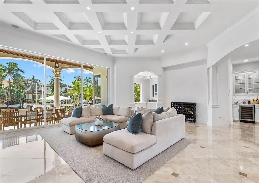 Don't miss this meticulously crafted 6 bed, 7.5 bath estate in Lighthouse Point! $2M in upgrades include a commercial bar, stunning movie theater, and a private oasis with a full-service dock. Your dream home awaits at 2520 NE 31st Ct.