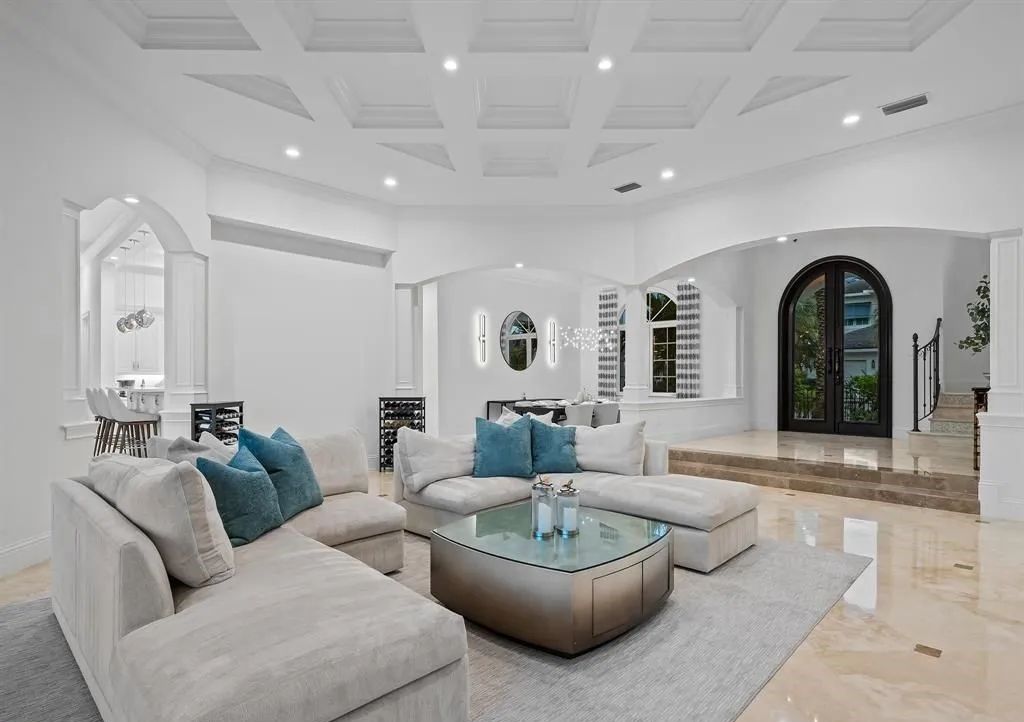 Don't miss this meticulously crafted 6 bed, 7.5 bath estate in Lighthouse Point! $2M in upgrades include a commercial bar, stunning movie theater, and a private oasis with a full-service dock. Your dream home awaits at 2520 NE 31st Ct.