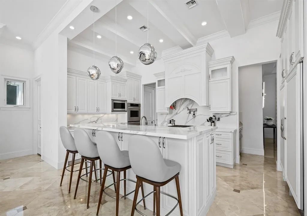 Don't miss this meticulously crafted 6 bed, 7.5 bath estate in Lighthouse Point! $2M in upgrades include a commercial bar, stunning movie theater, and a private oasis with a full-service dock. Your dream home awaits at 2520 NE 31st Ct.