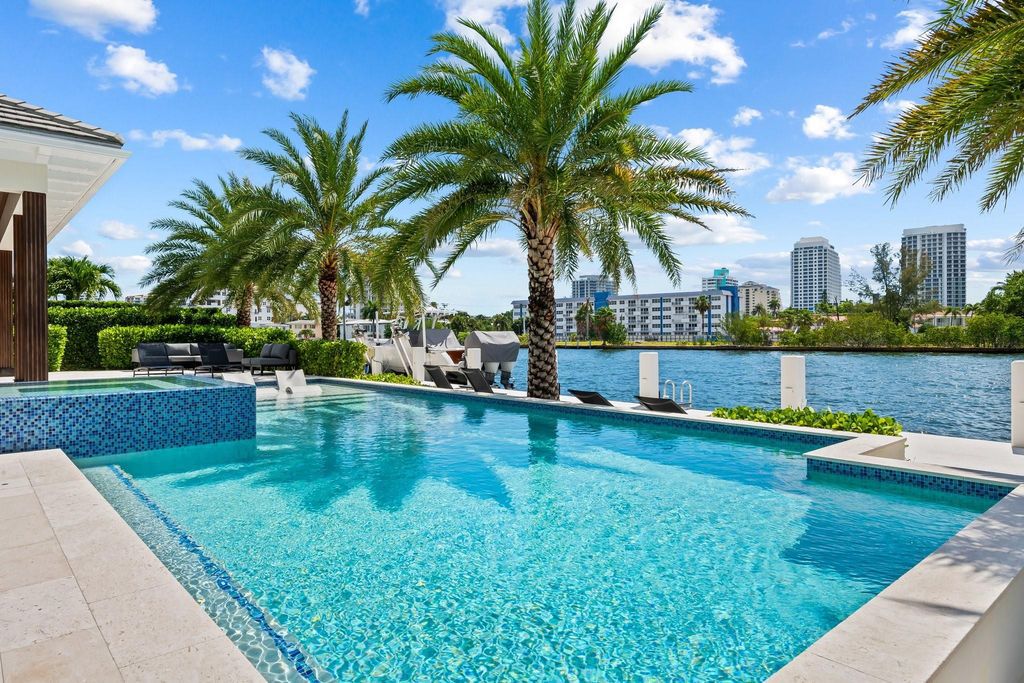 Live the resort life in this stunning single-level estate by Randall Stofft. 110' Intracoastal frontage, pool, spa, fire pit! European oak floors, 2-car garages, boat lift, and prime Sunrise location near beaches, shopping, and dining.