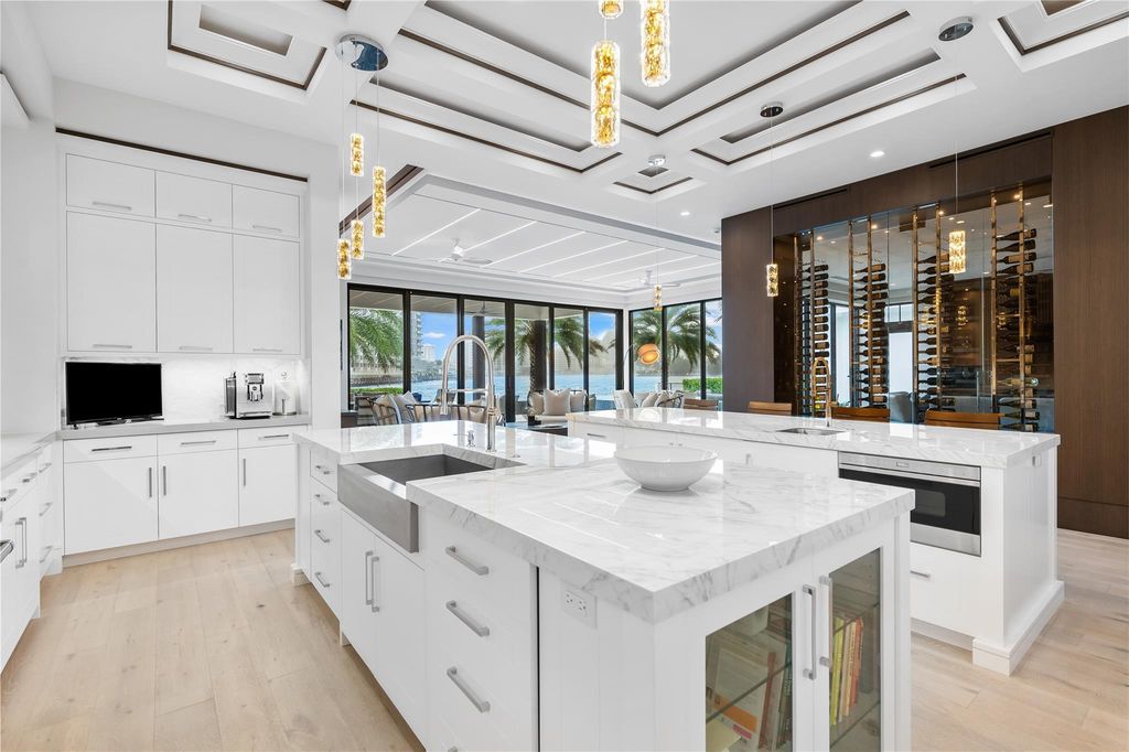 Live the resort life in this stunning single-level estate by Randall Stofft. 110' Intracoastal frontage, pool, spa, fire pit! European oak floors, 2-car garages, boat lift, and prime Sunrise location near beaches, shopping, and dining.