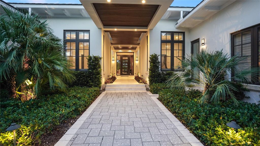 Live the resort life in this stunning single-level estate by Randall Stofft. 110' Intracoastal frontage, pool, spa, fire pit! European oak floors, 2-car garages, boat lift, and prime Sunrise location near beaches, shopping, and dining.