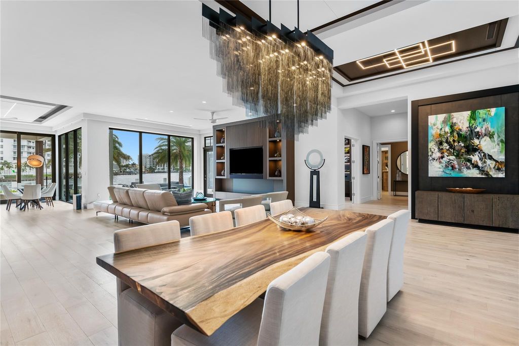 Live the resort life in this stunning single-level estate by Randall Stofft. 110' Intracoastal frontage, pool, spa, fire pit! European oak floors, 2-car garages, boat lift, and prime Sunrise location near beaches, shopping, and dining.