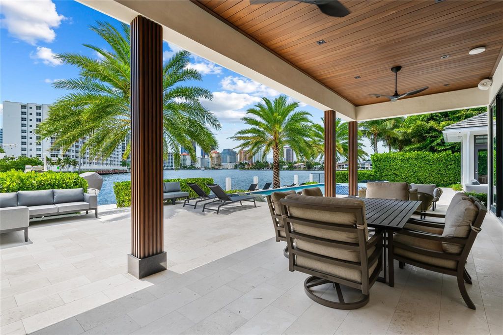 Live the resort life in this stunning single-level estate by Randall Stofft. 110' Intracoastal frontage, pool, spa, fire pit! European oak floors, 2-car garages, boat lift, and prime Sunrise location near beaches, shopping, and dining.