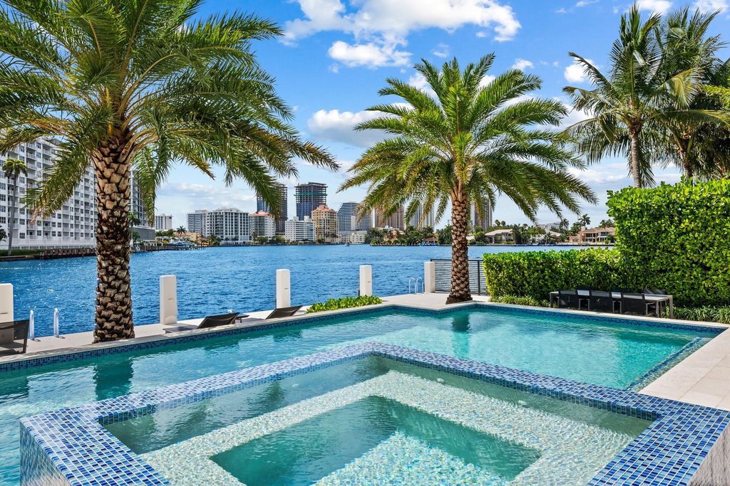 Live the resort life in this stunning single-level estate by Randall Stofft. 110' Intracoastal frontage, pool, spa, fire pit! European oak floors, 2-car garages, boat lift, and prime Sunrise location near beaches, shopping, and dining.