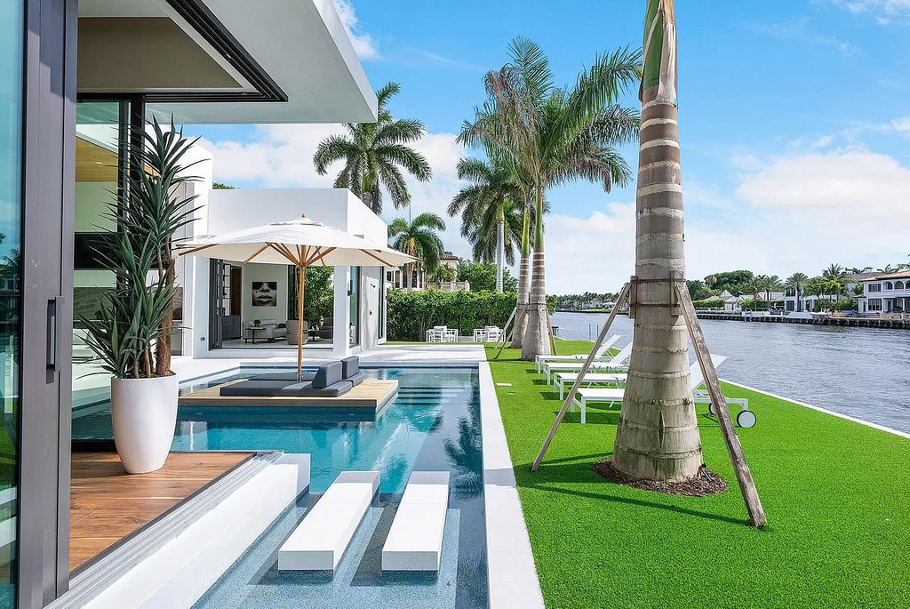 Experience Florida living at its finest in this modern, single-level Intracoastal home. 4 bedrooms, glass-enclosed office, club room, volume ceilings and private gated entrance. Priced to sell! BEST VALUE on the Intracoastal!