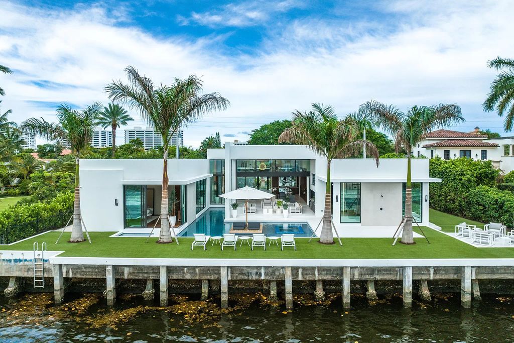 Experience Florida living at its finest in this modern, single-level Intracoastal home. 4 bedrooms, glass-enclosed office, club room, volume ceilings and private gated entrance. Priced to sell! BEST VALUE on the Intracoastal!