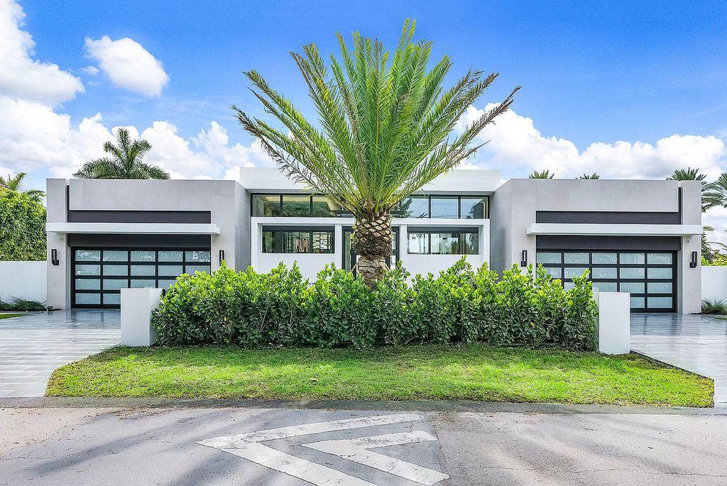 Experience Florida living at its finest in this modern, single-level Intracoastal home. 4 bedrooms, glass-enclosed office, club room, volume ceilings and private gated entrance. Priced to sell! BEST VALUE on the Intracoastal!