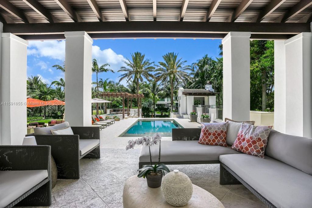 Designed by Christina Leon, this 13,147 square feet estate in Gables Estates offers unparalleled luxury. 4 beds and staff quarters, theater, gym, sauna, wine cellar, and expansive outdoor living with pool, jacuzzi, and private dock. Your waterfront paradise awaits!