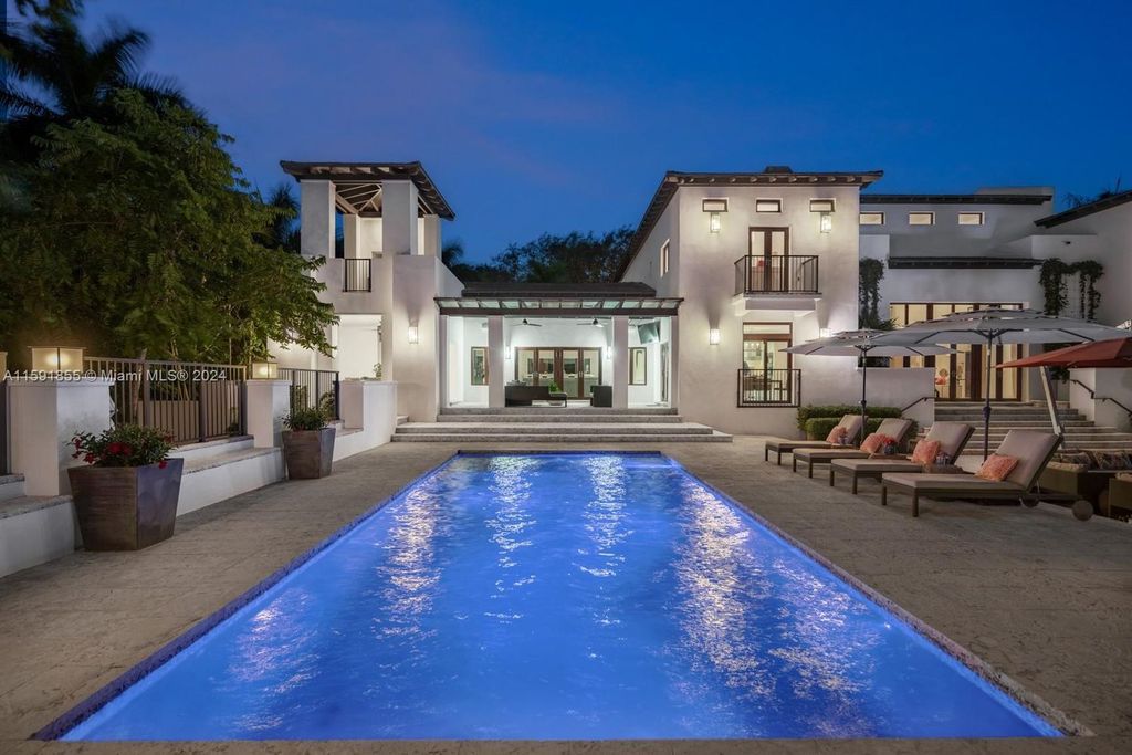 Designed by Christina Leon, this 13,147 square feet estate in Gables Estates offers unparalleled luxury. 4 beds and staff quarters, theater, gym, sauna, wine cellar, and expansive outdoor living with pool, jacuzzi, and private dock. Your waterfront paradise awaits!