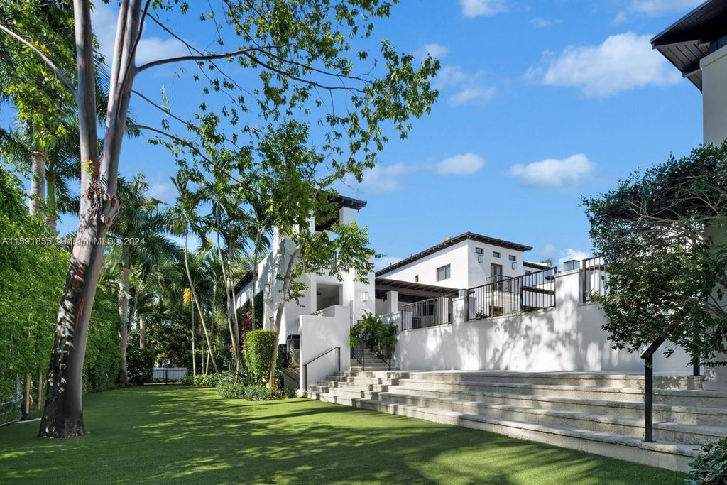 Designed by Christina Leon, this 13,147 square feet estate in Gables Estates offers unparalleled luxury. 4 beds and staff quarters, theater, gym, sauna, wine cellar, and expansive outdoor living with pool, jacuzzi, and private dock. Your waterfront paradise awaits!