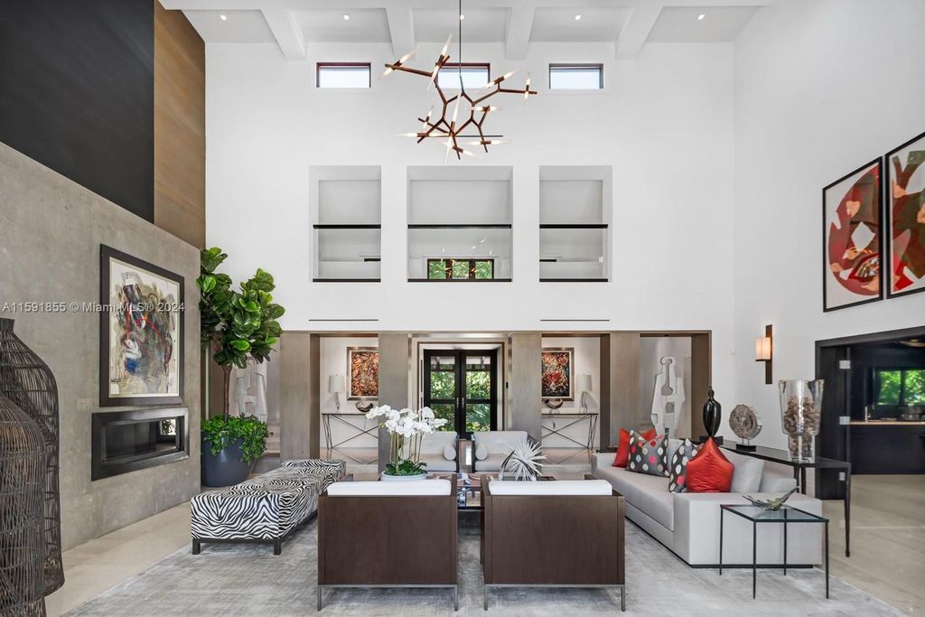 Designed by Christina Leon, this 13,147 square feet estate in Gables Estates offers unparalleled luxury. 4 beds and staff quarters, theater, gym, sauna, wine cellar, and expansive outdoor living with pool, jacuzzi, and private dock. Your waterfront paradise awaits!