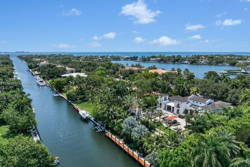 Designed by Christina Leon, this 13,147 square feet estate in Gables Estates offers unparalleled luxury. 4 beds and staff quarters, theater, gym, sauna, wine cellar, and expansive outdoor living with pool, jacuzzi, and private dock. Your waterfront paradise awaits!