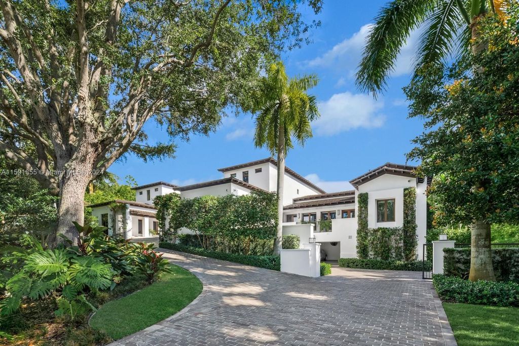 Designed by Christina Leon, this 13,147 square feet estate in Gables Estates offers unparalleled luxury. 4 beds and staff quarters, theater, gym, sauna, wine cellar, and expansive outdoor living with pool, jacuzzi, and private dock. Your waterfront paradise awaits!