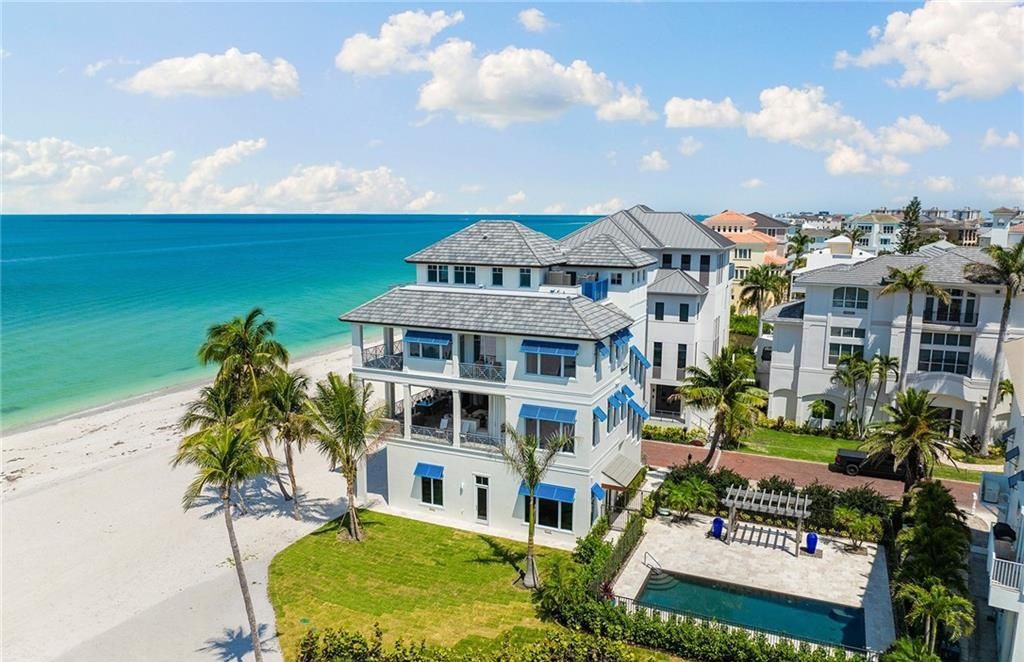 Immerse yourself in luxury living at this 7,490 sq ft beachfront estate. Custom-built with high-end finishes, this 4-bedroom home boasts a chef's kitchen, private pool, and expansive Gulf views. Perfect for entertaining, with private balconies and an open floor plan. Live the Barefoot Beach dream today!