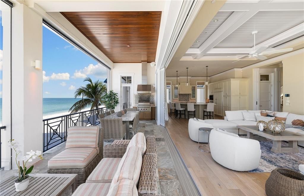 Immerse yourself in luxury living at this 7,490 sq ft beachfront estate. Custom-built with high-end finishes, this 4-bedroom home boasts a chef's kitchen, private pool, and expansive Gulf views. Perfect for entertaining, with private balconies and an open floor plan. Live the Barefoot Beach dream today!