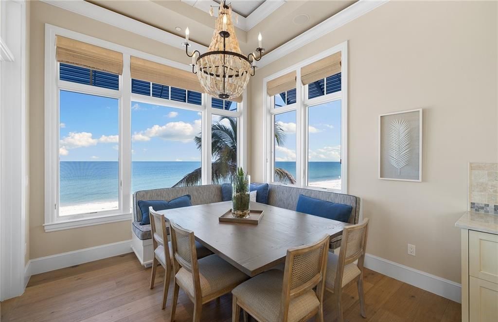 Immerse yourself in luxury living at this 7,490 sq ft beachfront estate. Custom-built with high-end finishes, this 4-bedroom home boasts a chef's kitchen, private pool, and expansive Gulf views. Perfect for entertaining, with private balconies and an open floor plan. Live the Barefoot Beach dream today!