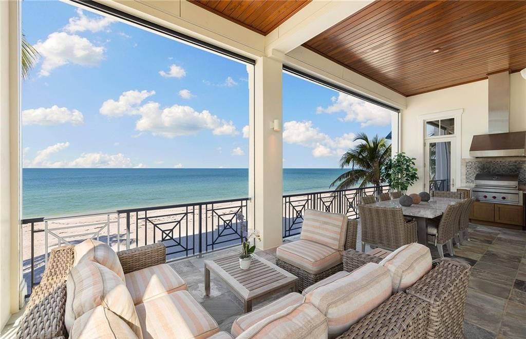 Immerse yourself in luxury living at this 7,490 sq ft beachfront estate. Custom-built with high-end finishes, this 4-bedroom home boasts a chef's kitchen, private pool, and expansive Gulf views. Perfect for entertaining, with private balconies and an open floor plan. Live the Barefoot Beach dream today!