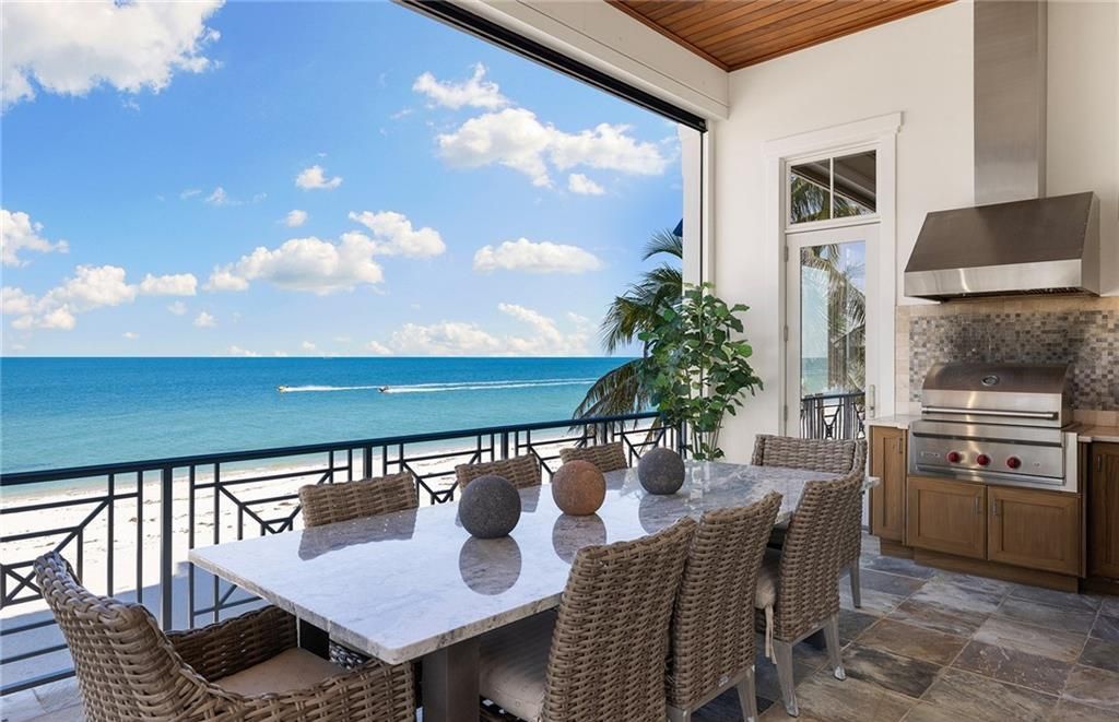 Immerse yourself in luxury living at this 7,490 sq ft beachfront estate. Custom-built with high-end finishes, this 4-bedroom home boasts a chef's kitchen, private pool, and expansive Gulf views. Perfect for entertaining, with private balconies and an open floor plan. Live the Barefoot Beach dream today!