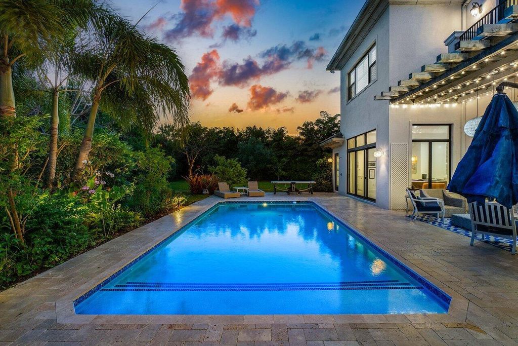 Indulge in luxury living at this sprawling 7,600 SF estate featured in Palm Beach Illustrated. Nestled in prestigious Kensington enclave, this home boasts a private backyard oasis with pool, summer kitchen, and lush landscaping. Residents enjoy world-class amenities in Seven Bridges!