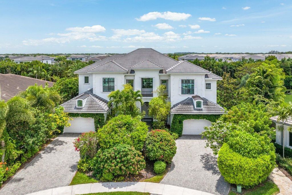 Indulge in luxury living at this sprawling 7,600 SF estate featured in Palm Beach Illustrated. Nestled in prestigious Kensington enclave, this home boasts a private backyard oasis with pool, summer kitchen, and lush landscaping. Residents enjoy world-class amenities in Seven Bridges!