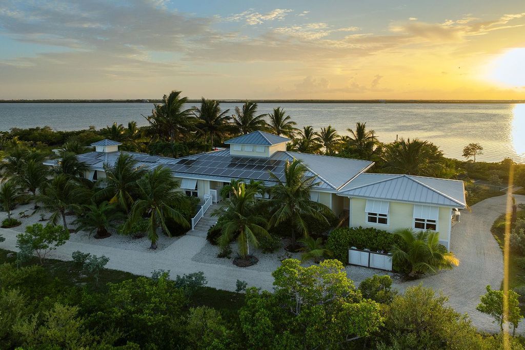 Seeking a one-of-a-kind escape? Howell Key, a turnkey 9.69-acre island paradise, awaits! This off-grid oasis boasts a 5-bedroom immaculate home, saltwater pool, guest house, helipad. Direct ocean access, proximity to Looe Key Sanctuary, and a second ROGO-exempt permit for your dream home make this the ultimate investment opportunity. Live your island dream or create an unforgettable vacation rental experience.