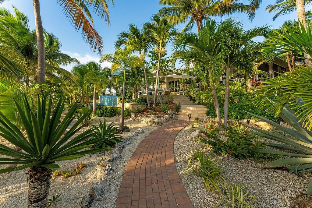 Seeking a one-of-a-kind escape? Howell Key, a turnkey 9.69-acre island paradise, awaits! This off-grid oasis boasts a 5-bedroom immaculate home, saltwater pool, guest house, helipad. Direct ocean access, proximity to Looe Key Sanctuary, and a second ROGO-exempt permit for your dream home make this the ultimate investment opportunity. Live your island dream or create an unforgettable vacation rental experience.