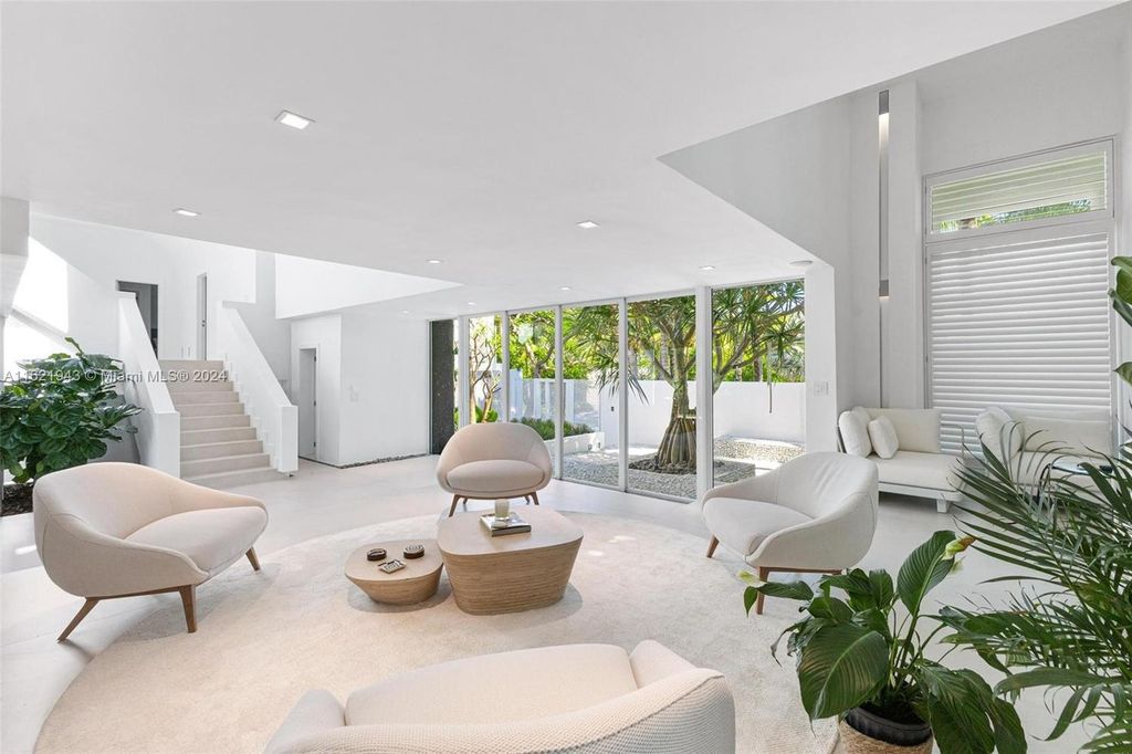 Immerse yourself in unparalleled luxury living in this stunning, completely renovated Key Biscayne waterfront home. Indulge in breathtaking canal views, a contemporary design, a private oasis, and top-of-the-line amenities, including a gym, home theater, summer kitchen, and boat lift. This 4-bedroom (easily convertible to 5) estate offers the ultimate in waterfront living.