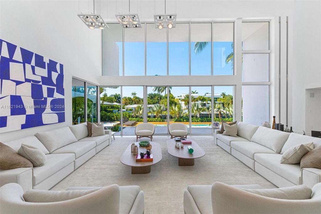 Immerse yourself in unparalleled luxury living in this stunning, completely renovated Key Biscayne waterfront home. Indulge in breathtaking canal views, a contemporary design, a private oasis, and top-of-the-line amenities, including a gym, home theater, summer kitchen, and boat lift. This 4-bedroom (easily convertible to 5) estate offers the ultimate in waterfront living.