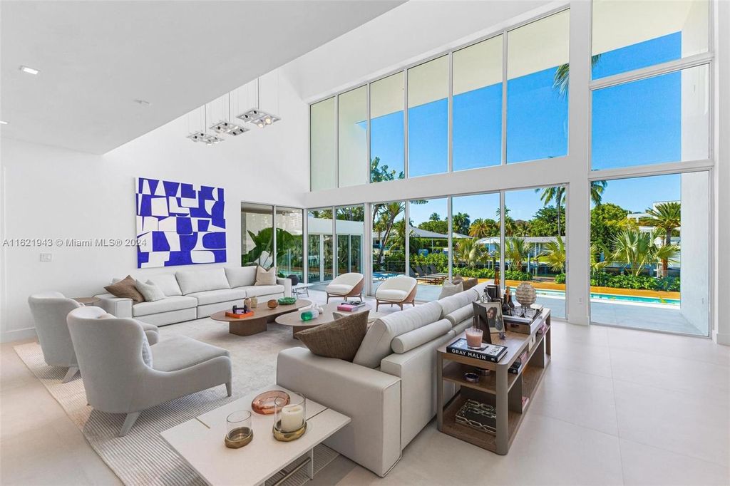 Immerse yourself in unparalleled luxury living in this stunning, completely renovated Key Biscayne waterfront home. Indulge in breathtaking canal views, a contemporary design, a private oasis, and top-of-the-line amenities, including a gym, home theater, summer kitchen, and boat lift. This 4-bedroom (easily convertible to 5) estate offers the ultimate in waterfront living.