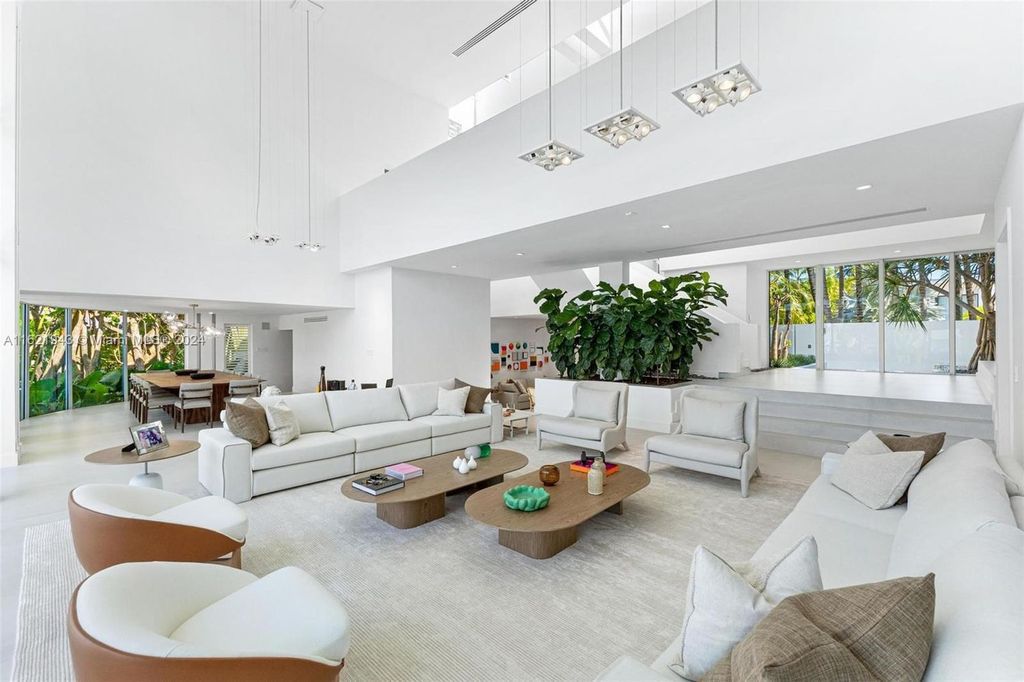 Immerse yourself in unparalleled luxury living in this stunning, completely renovated Key Biscayne waterfront home. Indulge in breathtaking canal views, a contemporary design, a private oasis, and top-of-the-line amenities, including a gym, home theater, summer kitchen, and boat lift. This 4-bedroom (easily convertible to 5) estate offers the ultimate in waterfront living.