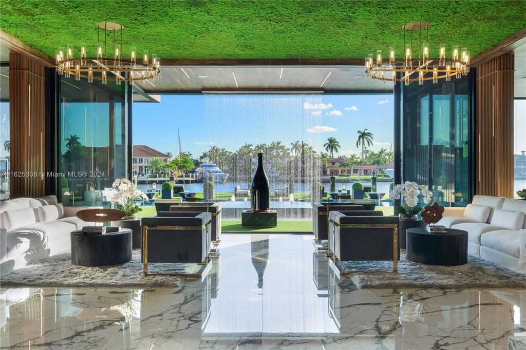 Live the ultimate Fort Lauderdale lifestyle in this 11,000+ square feet waterfront mansion by Dov Stark. Featuring deep water frontage, 5 beds, 11 baths, theater, gym, and more!