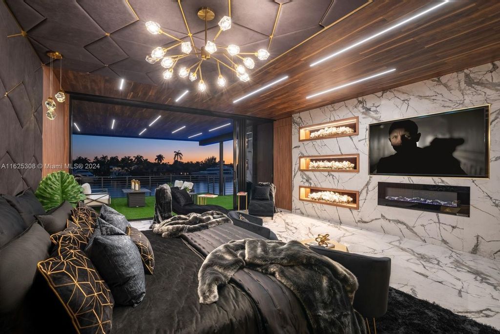 Live the ultimate Fort Lauderdale lifestyle in this 11,000+ square feet waterfront mansion by Dov Stark. Featuring deep water frontage, 5 beds, 11 baths, theater, gym, and more!