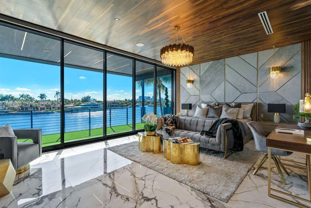 Live the ultimate Fort Lauderdale lifestyle in this 11,000+ square feet waterfront mansion by Dov Stark. Featuring deep water frontage, 5 beds, 11 baths, theater, gym, and more!