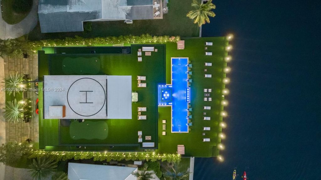 Live the ultimate Fort Lauderdale lifestyle in this 11,000+ square feet waterfront mansion by Dov Stark. Featuring deep water frontage, 5 beds, 11 baths, theater, gym, and more!