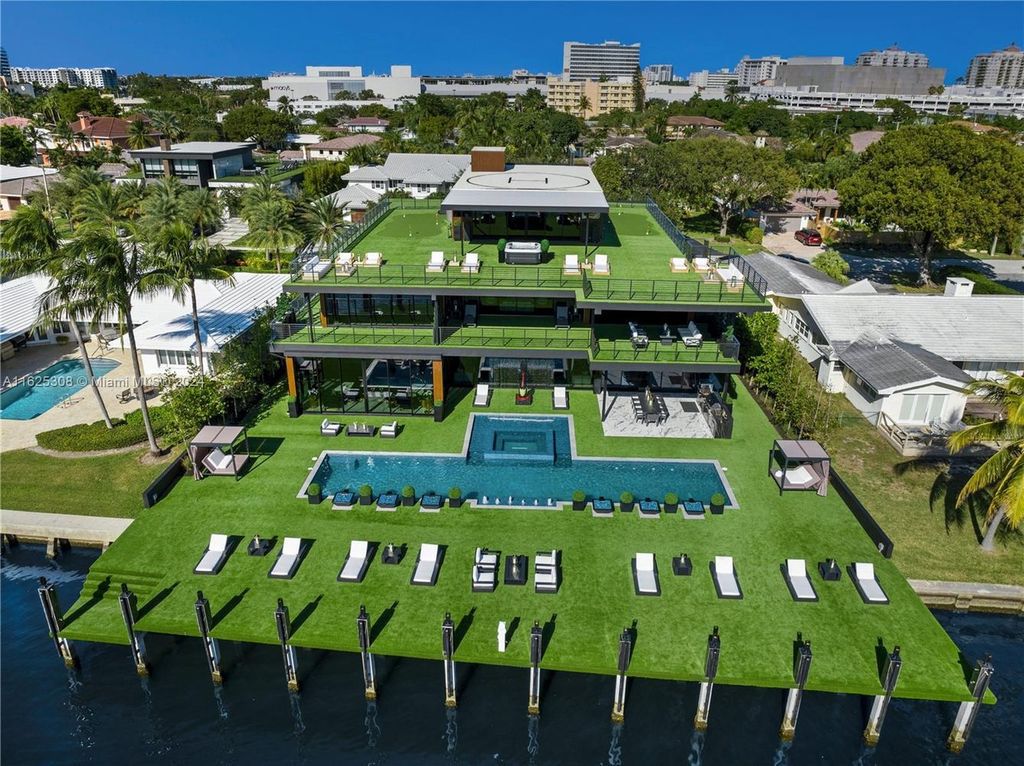 Live the ultimate Fort Lauderdale lifestyle in this 11,000+ square feet waterfront mansion by Dov Stark. Featuring deep water frontage, 5 beds, 11 baths, theater, gym, and more!