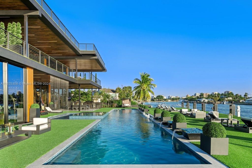 Live the ultimate Fort Lauderdale lifestyle in this 11,000+ square feet waterfront mansion by Dov Stark. Featuring deep water frontage, 5 beds, 11 baths, theater, gym, and more!