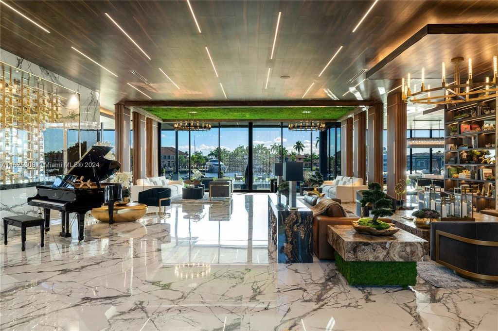 Live the ultimate Fort Lauderdale lifestyle in this 11,000+ square feet waterfront mansion by Dov Stark. Featuring deep water frontage, 5 beds, 11 baths, theater, gym, and more!