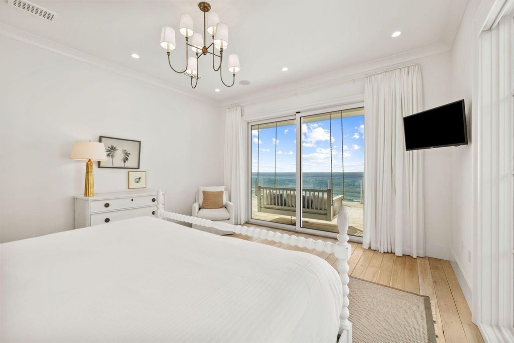 Unwind in beachfront bliss at this stunning 8-bedroom residence in Inlet Beach. Enjoy breathtaking ocean views, a private pool, gourmet kitchen, and multiple terraces. Perfect for family gatherings and unforgettable vacations!