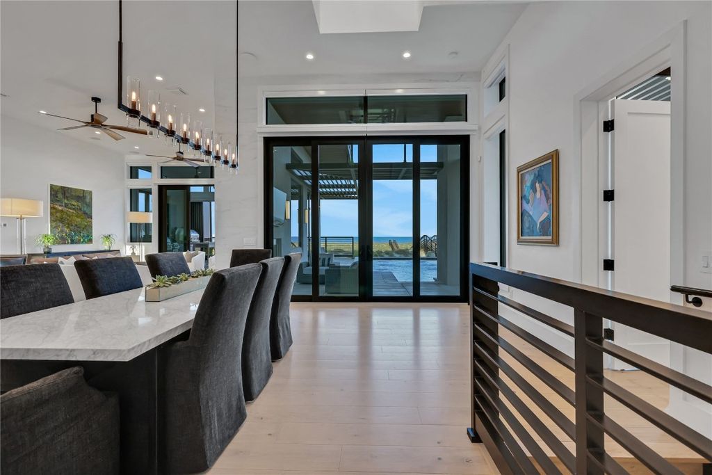 Immerse yourself in unparalleled luxury at this beachfront masterpiece on Amelia Island. This 6 bed, 8 bath custom estate boasts John Cotner design, commercial-grade construction, chef's kitchen, infinity pool and spa, and private guest house. Experience the epitome of coastal living.